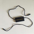 Garment plastic tag with PVC layer